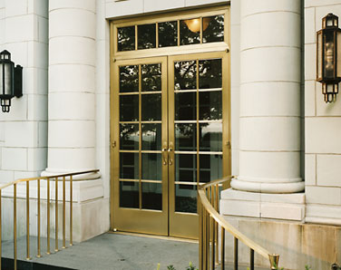 Satin bronze alloy exterior door, transom and hand rails