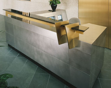 stainless steel and bronze alloy reception desk with satin finish